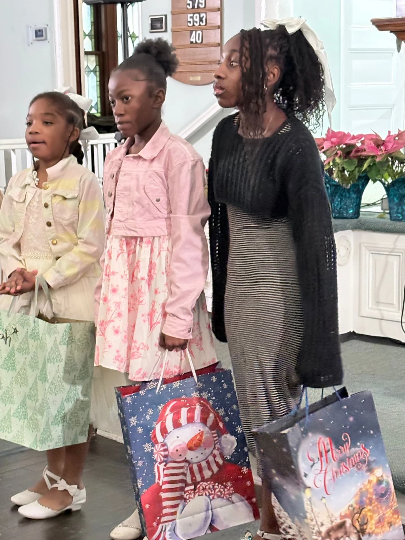 Children receiving Christmas gifts at church