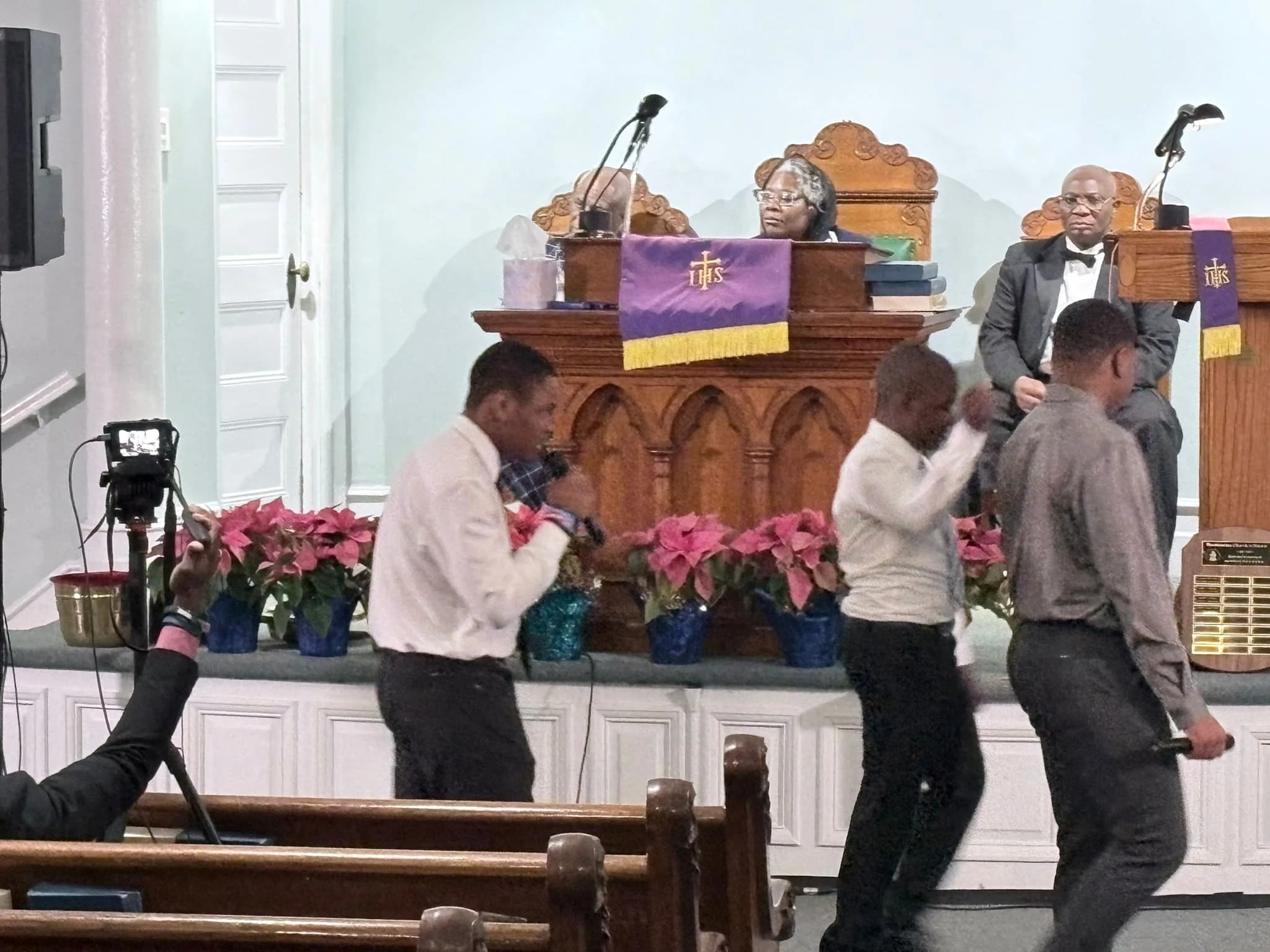 Young men praising through dance during the Christmas service